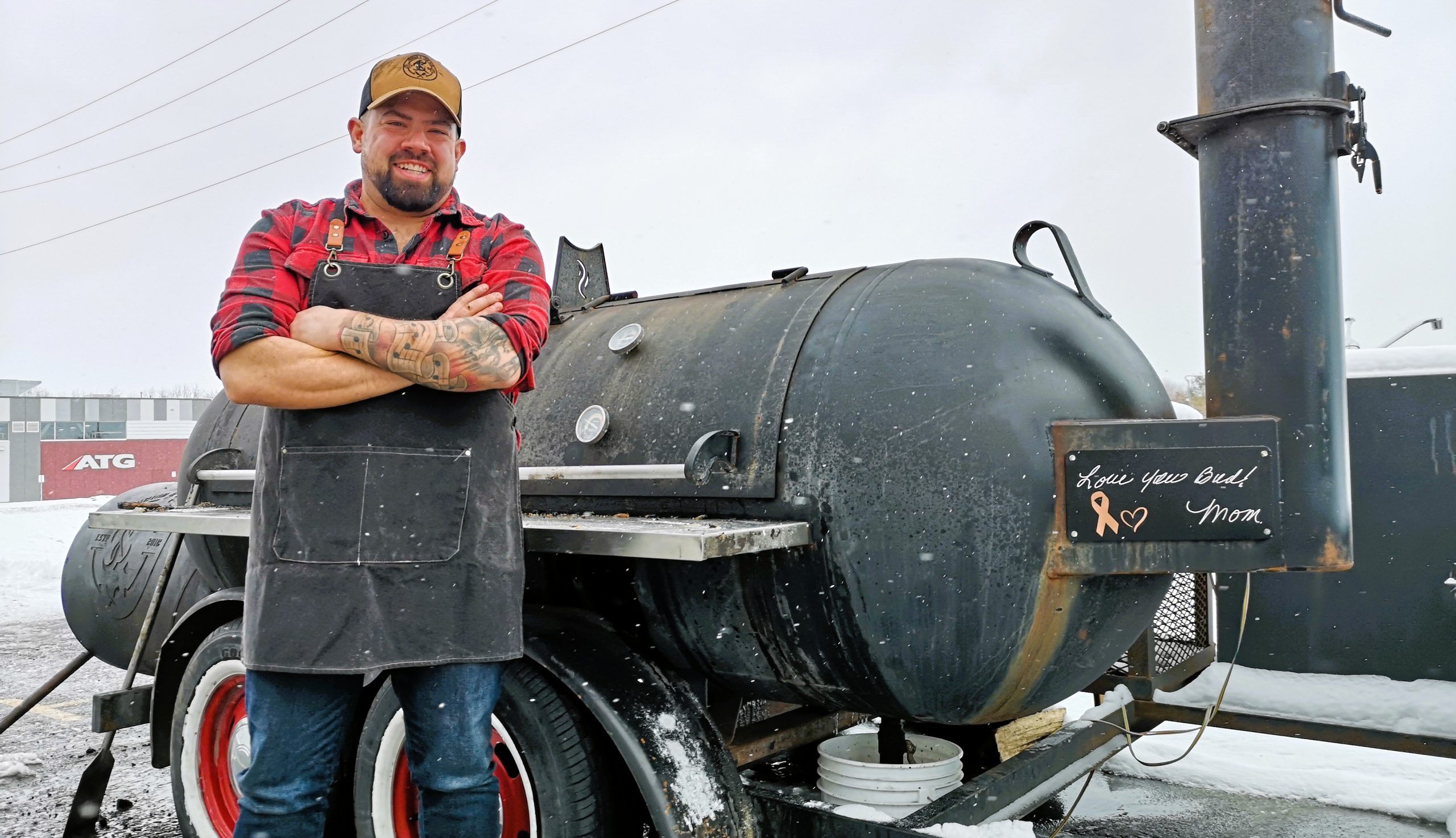 Chris Villeneuve stands next to his smoker, Tilly Mae. After running a pop-up shop, Junior and the Kid BBQ is now a permanent fixture on the Clarence-Rockland dining scene, with the opening of a brick-and-mortar shop in the Rockland Industrial Park. (Andrew Coppolino)