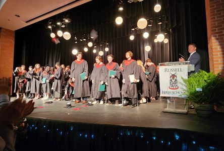 Russell High students cross the stage for graduation